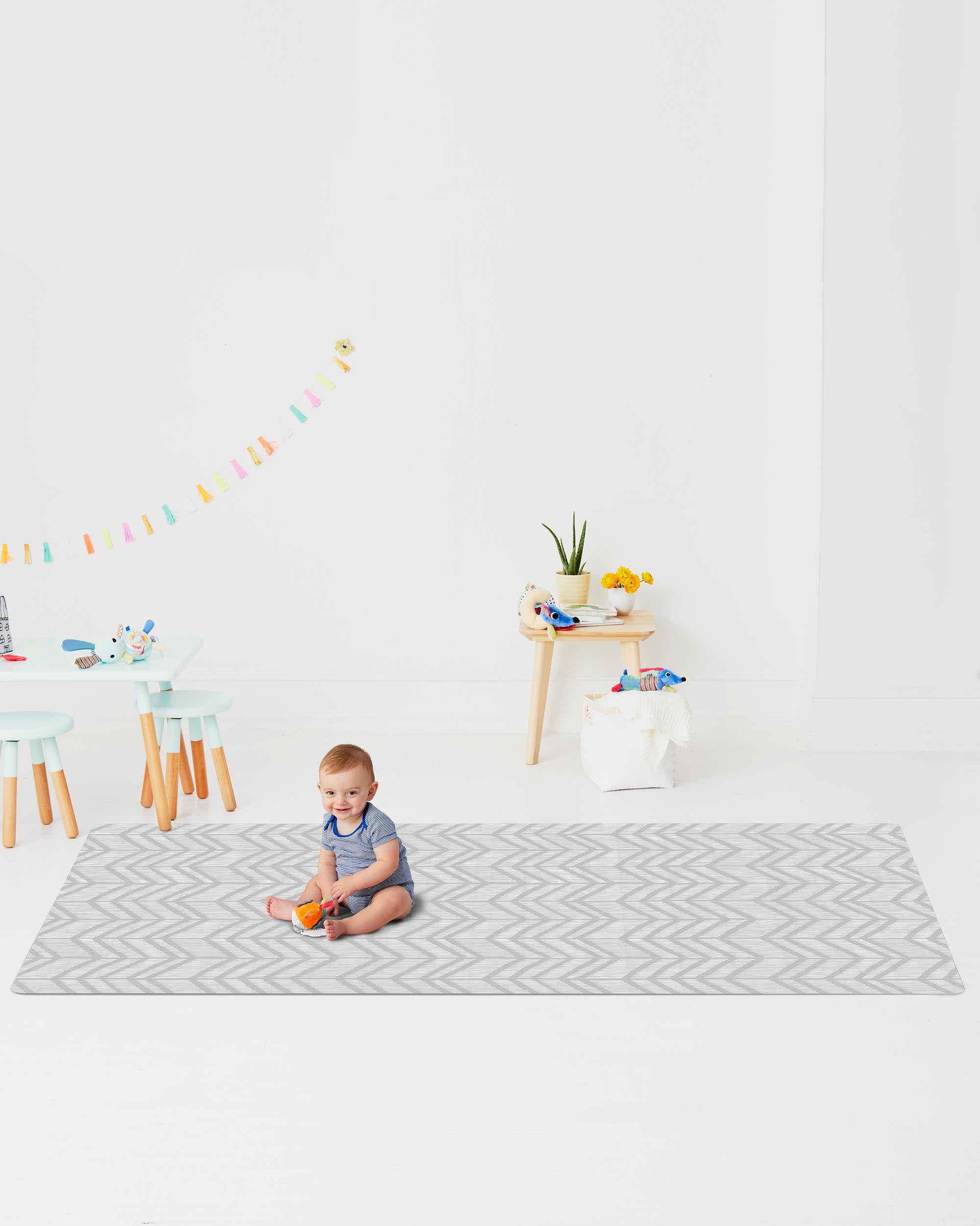 Toddler on the Skip Hop Doubleplay Reversible Playmat Little Travellers, chic decor side
