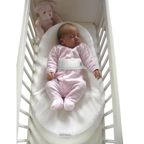 Baby in Cocoonababy® in cot