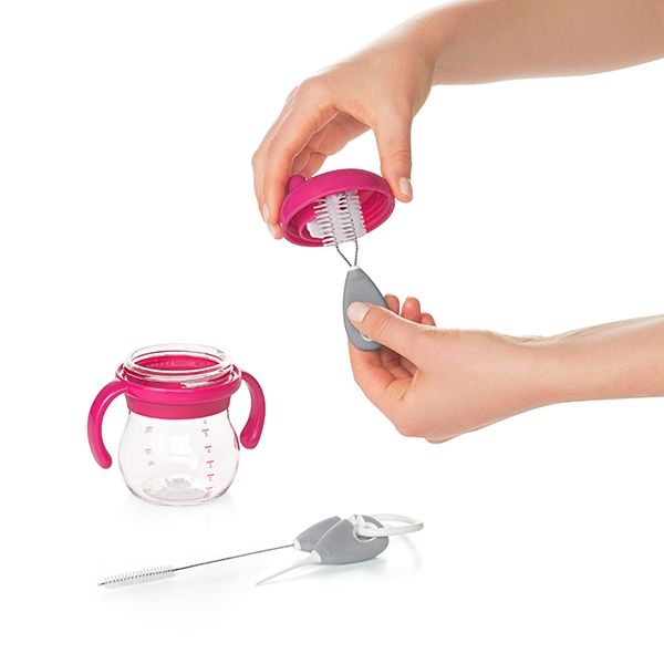 Using the OXO tot short brush to clean the sippy cup lid